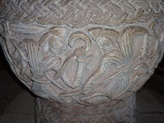 Close up view of carving on font.